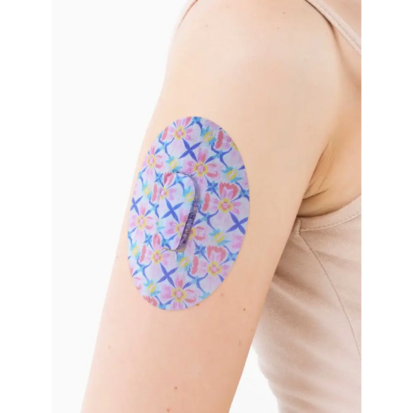 Dexcom G6 Patch from Spring Collection on arm, floral design, durable adhesion.