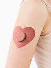 Freestyle Libre 2 heart patch worn on arm kids CGM adhesive patch ensuring secure sensor during movement