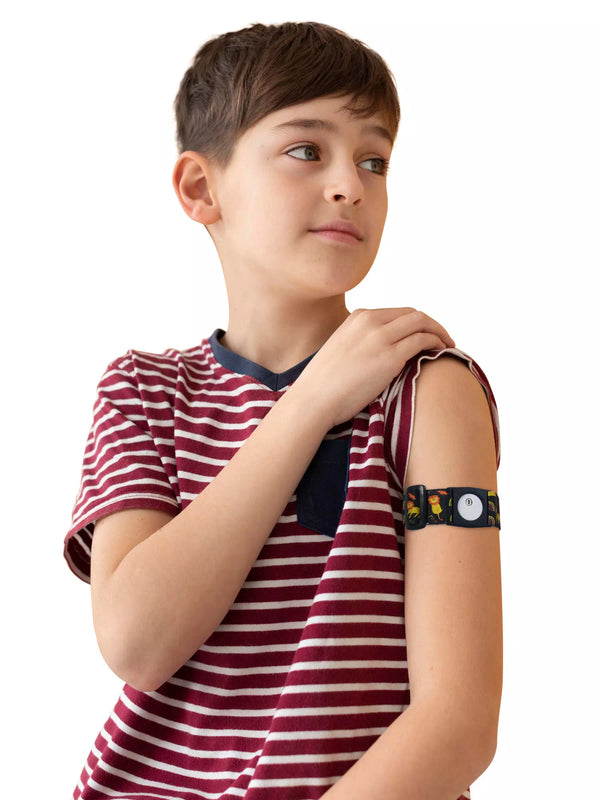 Child wearing Freestyle Libre 3 armband, Dia-Style Kiddy design, on arm for comfortable diabetes care.