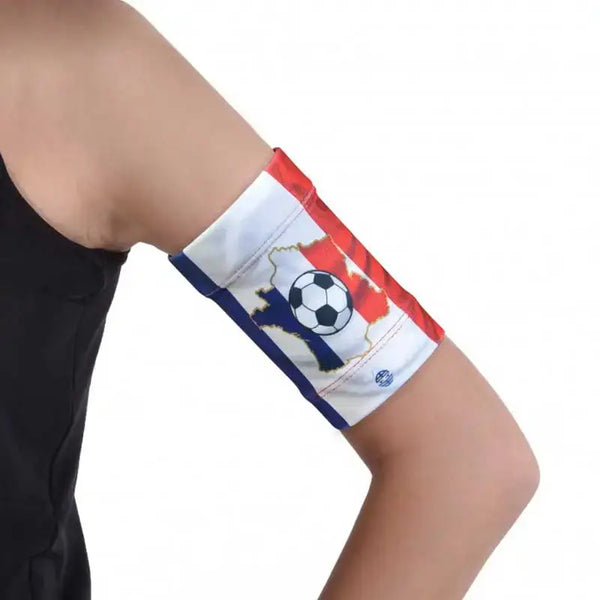 Glucose sensor and pod armband with flag print design for secure fit during activities.