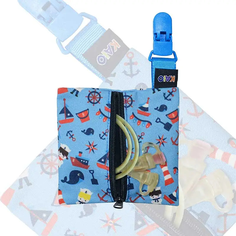Kaio-Tube Pouch for children's medical tubing, a compact blue fabric pouch with a nautical print and black zipper. Immagine