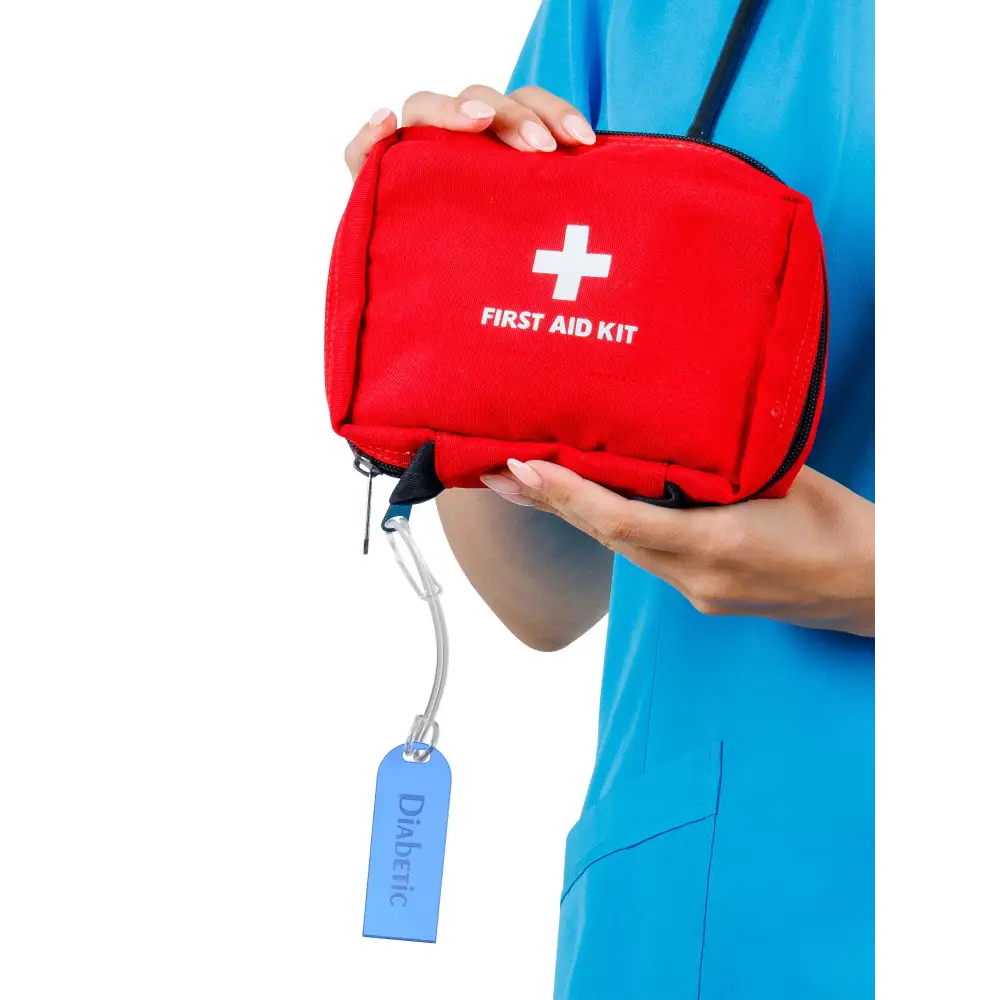 Diabetic luggage tag attached to a red first aid kit, showcasing clear identification for travelers with diabetes.
