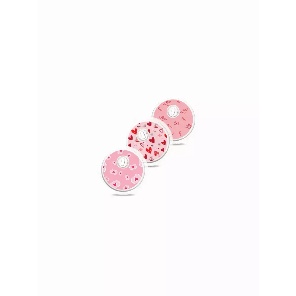 Valentine-themed Freestyle Libre 3 sensor stickers in pink and red designs.