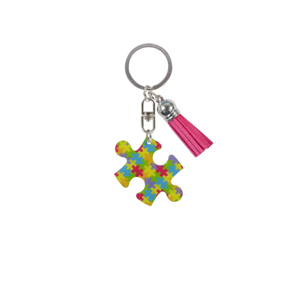 Medical Awareness Keychain featuring a colorful puzzle piece for Autism Awareness with a pink tassel.