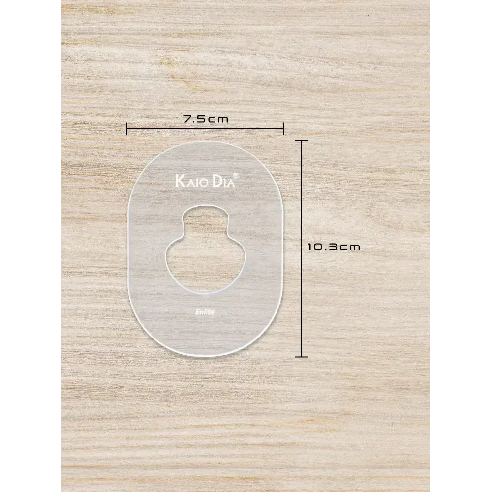CGM Sensor Patch Template on wooden background with dimensions 7.5cm by 10.3cm.