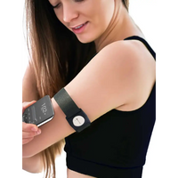 Dexcom G7 grey adjustable armband with rotating clip on woman's arm.