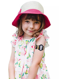 Child wearing Dexcom G6 adjustable armband, Dia-Style Kiddy, showcasing playful design and comfortable fit.