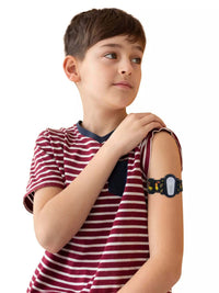 Child wearing Dexcom G6 adjustable armband with playful design.
