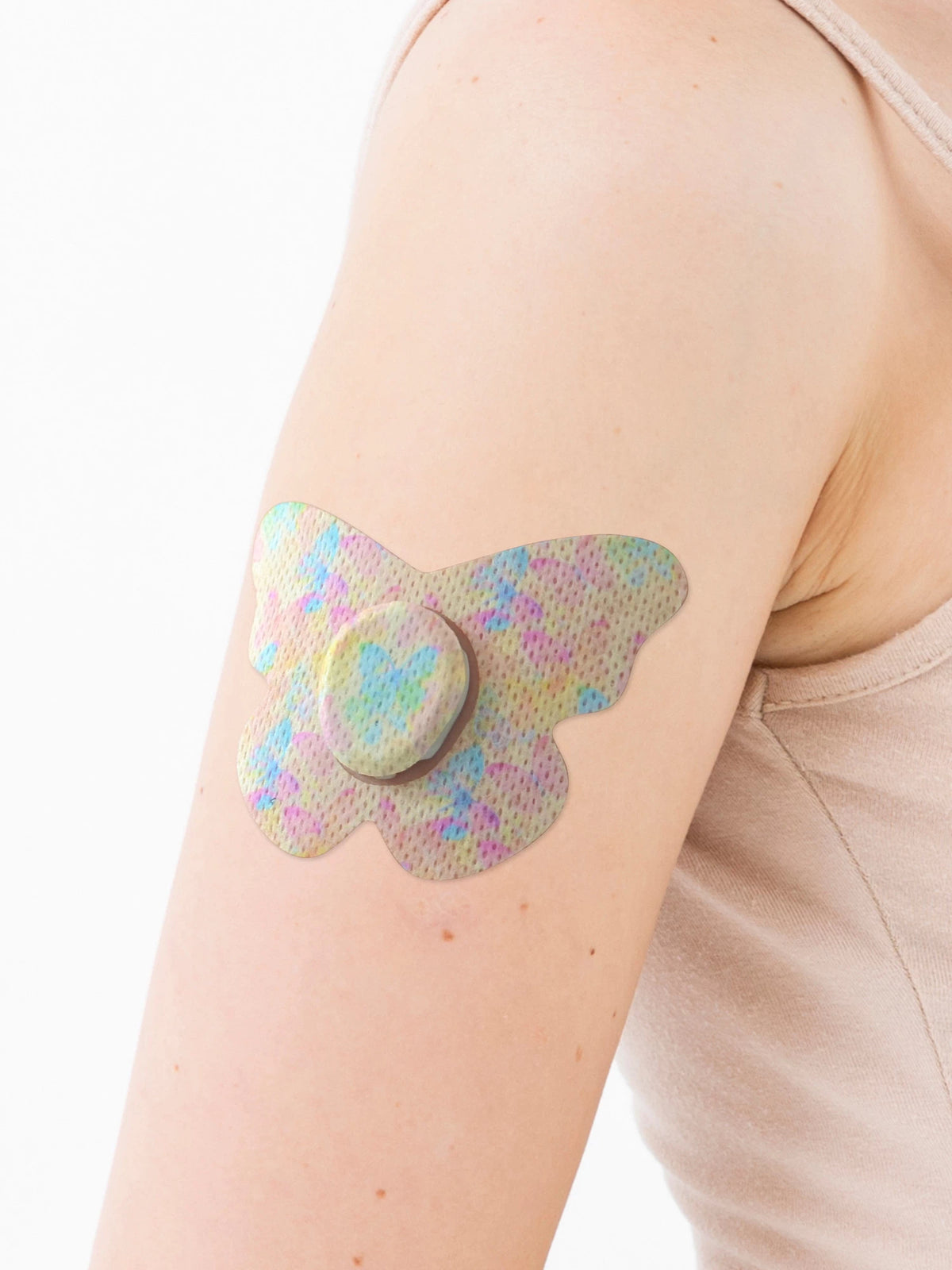 Cerotto adesivo per Dexcom G7, forma farfalla, sul braccio, primo piano
