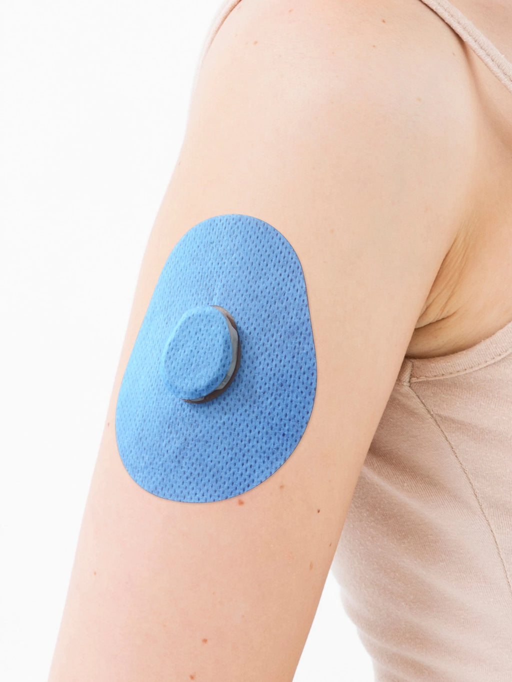 Cerotto adesivo per Dexcom G7, forma goccia, sul braccio, primo piano