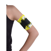Glucose monitor and insulin pump armband in vibrant yellow and black, worn on upper arm for secure diabetes device management.