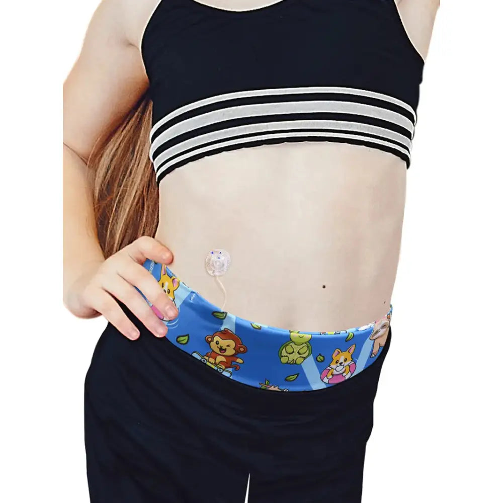 Child wearing a colorful Dia-BellyBand insulin pump waist belt with cartoon animal designs for small children