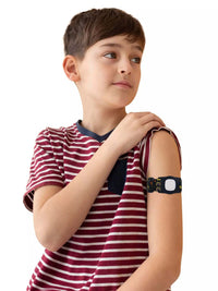 Child wearing Simplera Sync Armband with Rotating Clip for Medtronic Simplera sensor, showcasing secure fit and playful design.