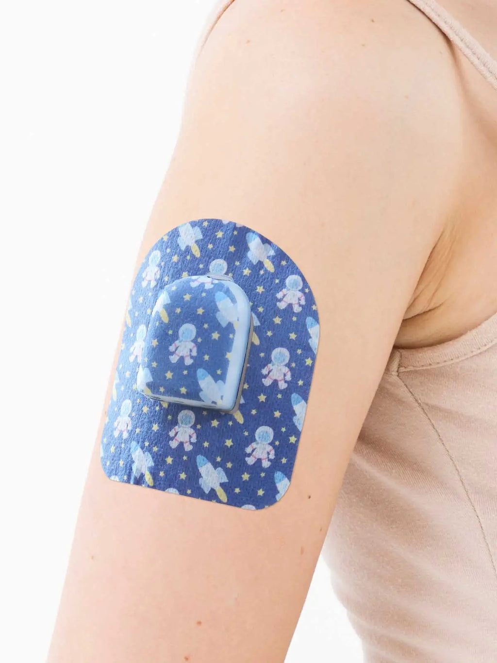Cerotto adesivo per Pod Omnipod, fantasia Astronaut, sul braccio