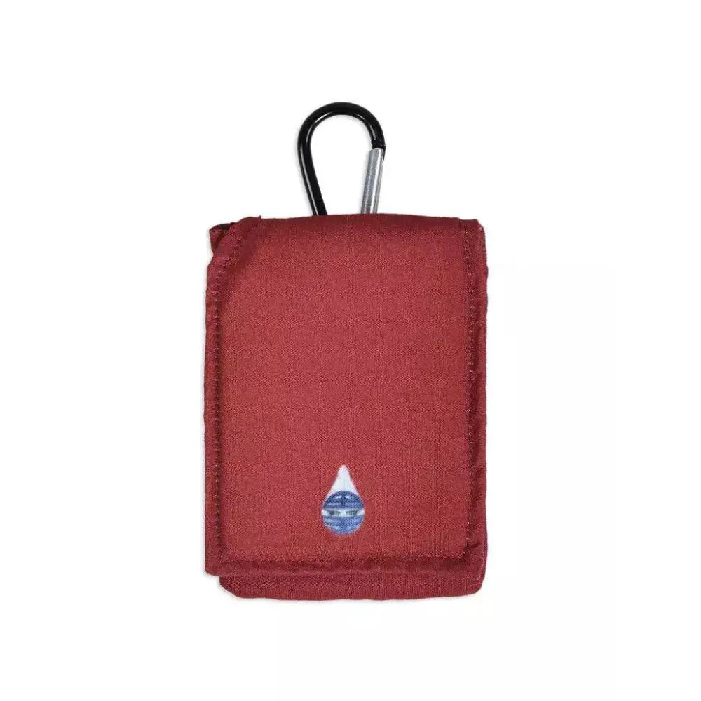 Red insulin pump cooling pouch with carabiner and gel packs for temperature control.