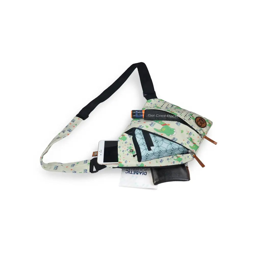 Children's shoulder bag with cooling system for insulin and diabetic supplies, featuring spacious compartments and adjustable strap